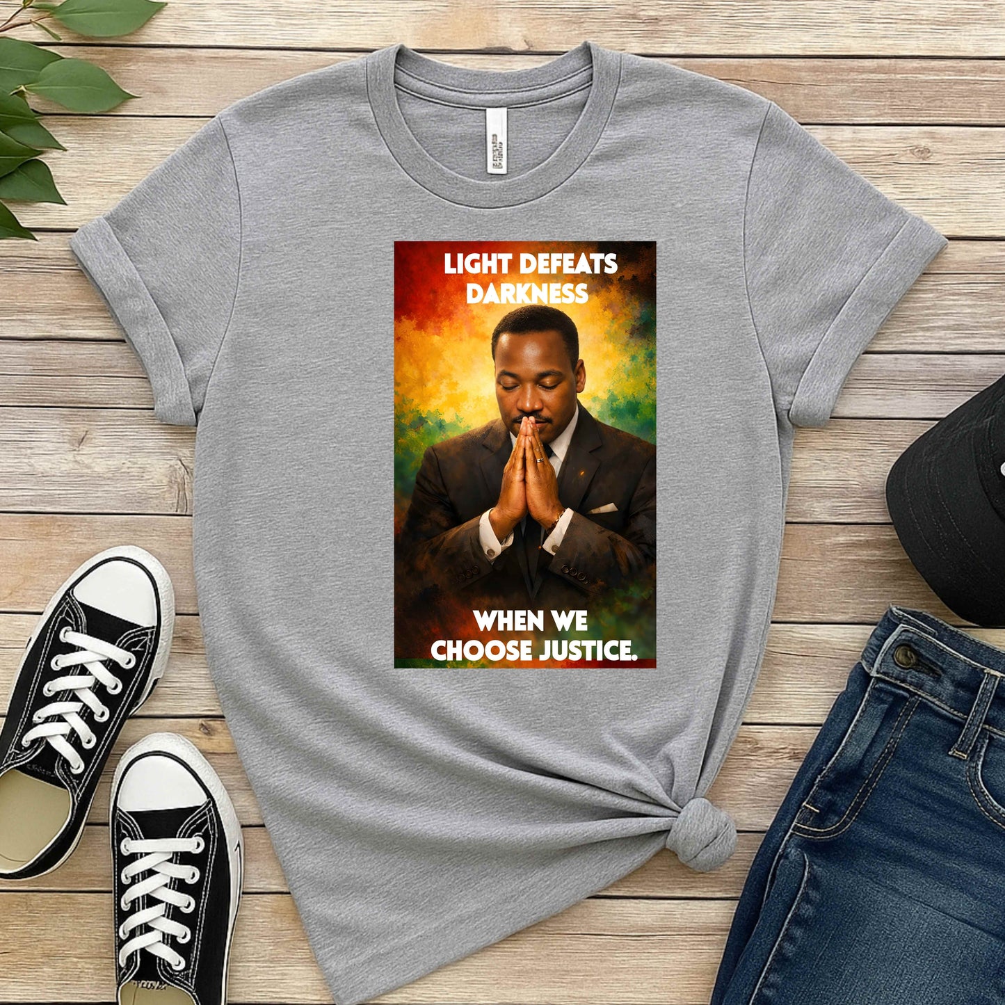 MLK LIGHT DEFEATS DARKNESS. T-Shirt